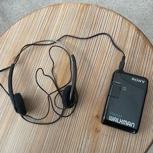 Vintage AM/FM Sony Walkman and Headphones